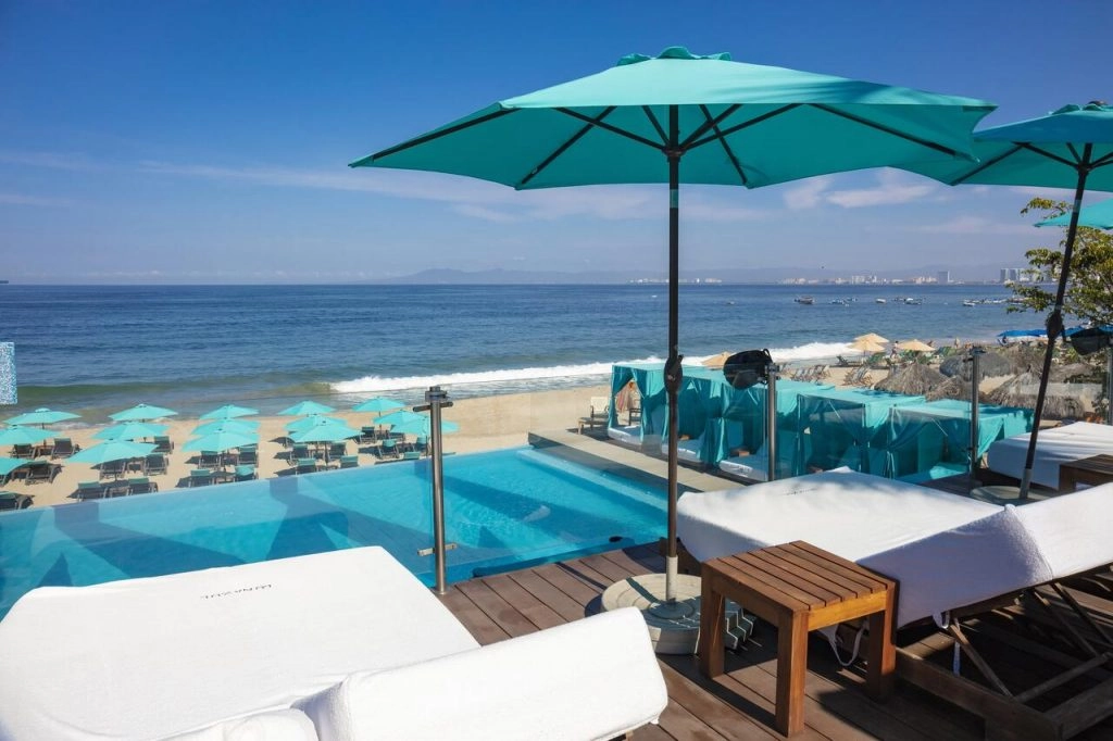 sun loungers at mantamar beach club overlooking the ocean