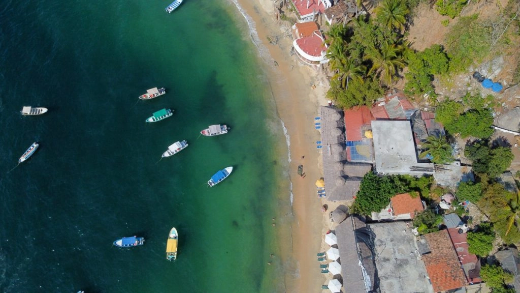 colorful boats in the ocean at playa las animas