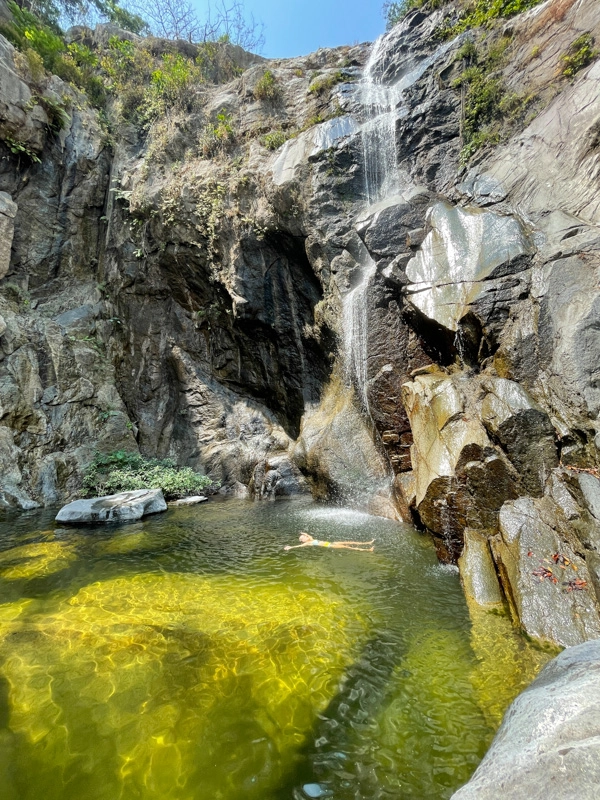 lora swimming under waterfall in puerto vallarta