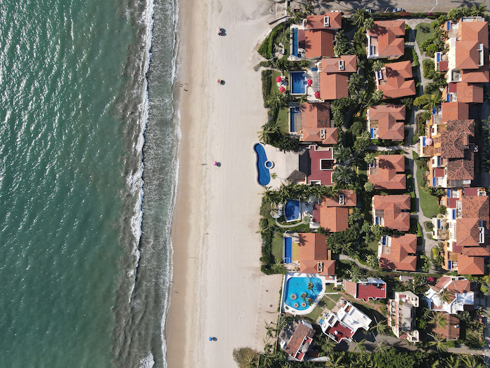 aerial photo of bucerias mexico half ocean and half town