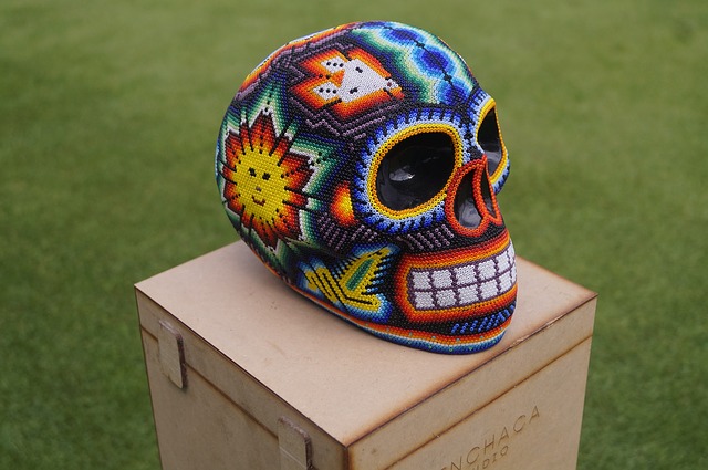 a colorful skull made of intricate bead art