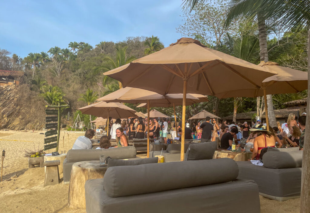 Majahuitas Beach Club welcomes visitors with its pristine white sand, swaying palm trees, and a tranquil atmosphere, 