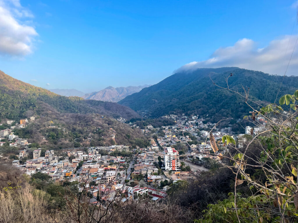 view of puerto vallarta against the backdrop of mountains while hiking in puerto vallarta