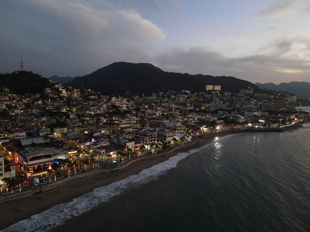 drone eye night view of puerto vallara