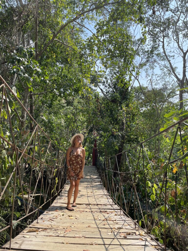 lora on a hanging bridge in the puerto vallarta botanical gardens