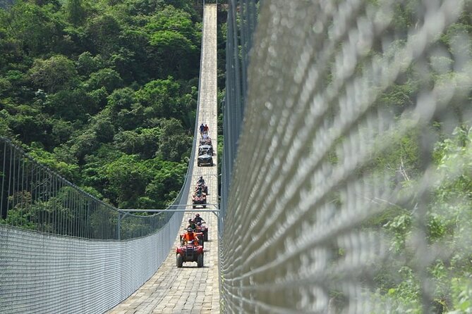 atv riders on the Jorullo Bridge