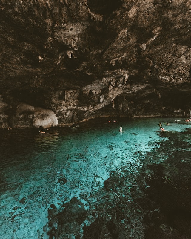 travelers snorkeling in a cenote tulum mexico