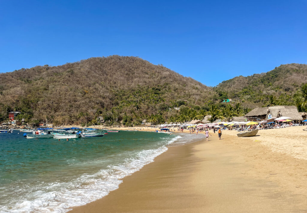 beach in yelapa mexico. waves gently crashing against the sand.