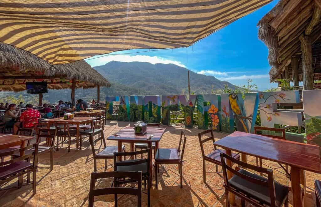 tables at canopy river restaurant with mountains in background