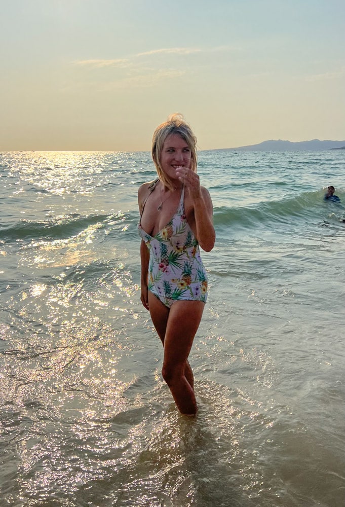lora smiling on the beach in puerto vallarta with the ocean in background