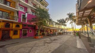 A vibrant street featuring colorful buildings, perfect for Puerto Vallarta Instagram spots.